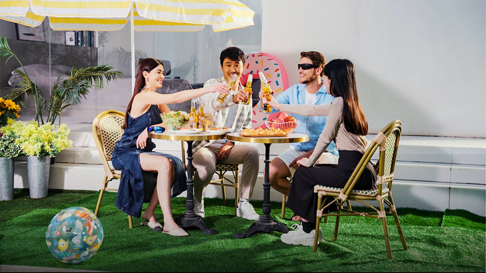 Group of friends toasting drinks captured with hands-free POV camera glasses during a social gathering.